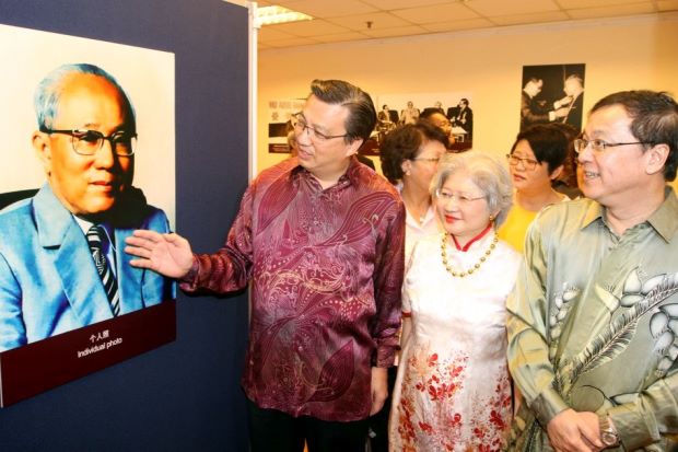 (From left) Liow, Tan Siok Choo and Dr Hou tour the exhibition on Tun Tan's centennial.