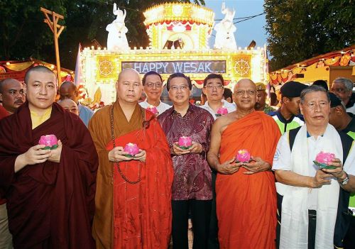 In harmony: Liow and Chief High Priest of Malaysia Ven. Datuk K Sri Dhammaratana Nayaka Maha Thera (second from right) joining the parade in Brickfields.